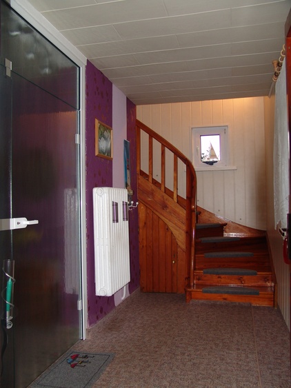 Der Eingangsbereich mit Blick auf den Treppenaufgang zu Ihrer Ferienwohnung.